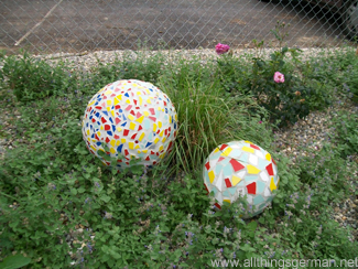 Mosaic balls in one of the flower beds at the Neckarbluehen Garden Show in Horb am Neckar 2011